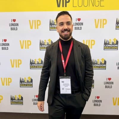 Mohamed El Hadri at London Build Expo, wearing an event lanyard
